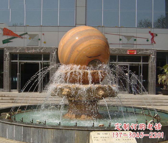 泸州石来运转球晚霞红风水球石雕