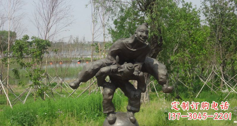 泸州园林站在球上面跳山羊的人物景观铜雕